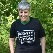 Woman wearing T-shirt Black Dignity, Equality, Purpose front